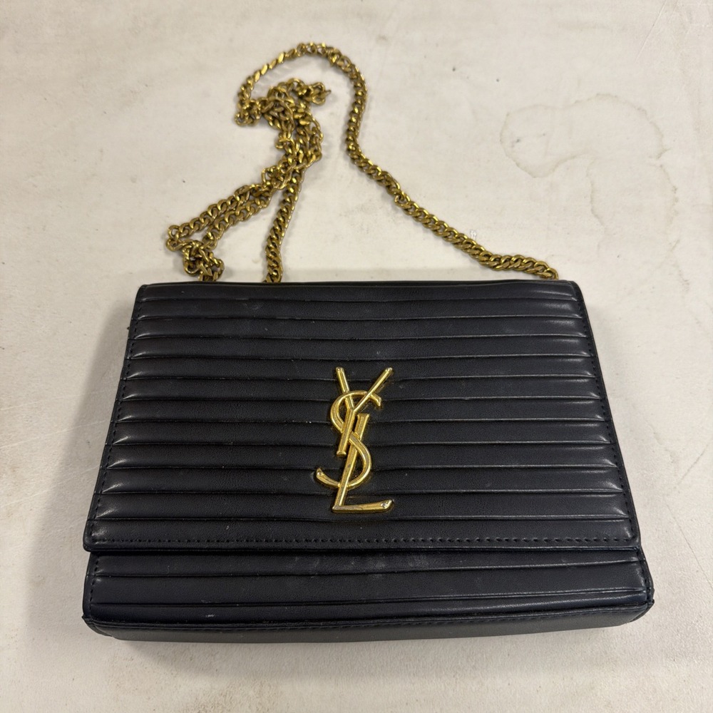 black pleated or ribbed leather shoulder bag with a gold-tone chain strap Ysl